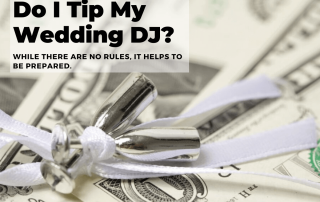 Silver wedding bells are placed on dollar bills. A text overlay reads, "Do I Tip My Wedding DJ? While there are no rules, it helps to be prepared.