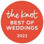 A round orange badge with white text that reads, "the knot BEST OF WEDDINGS 2022.